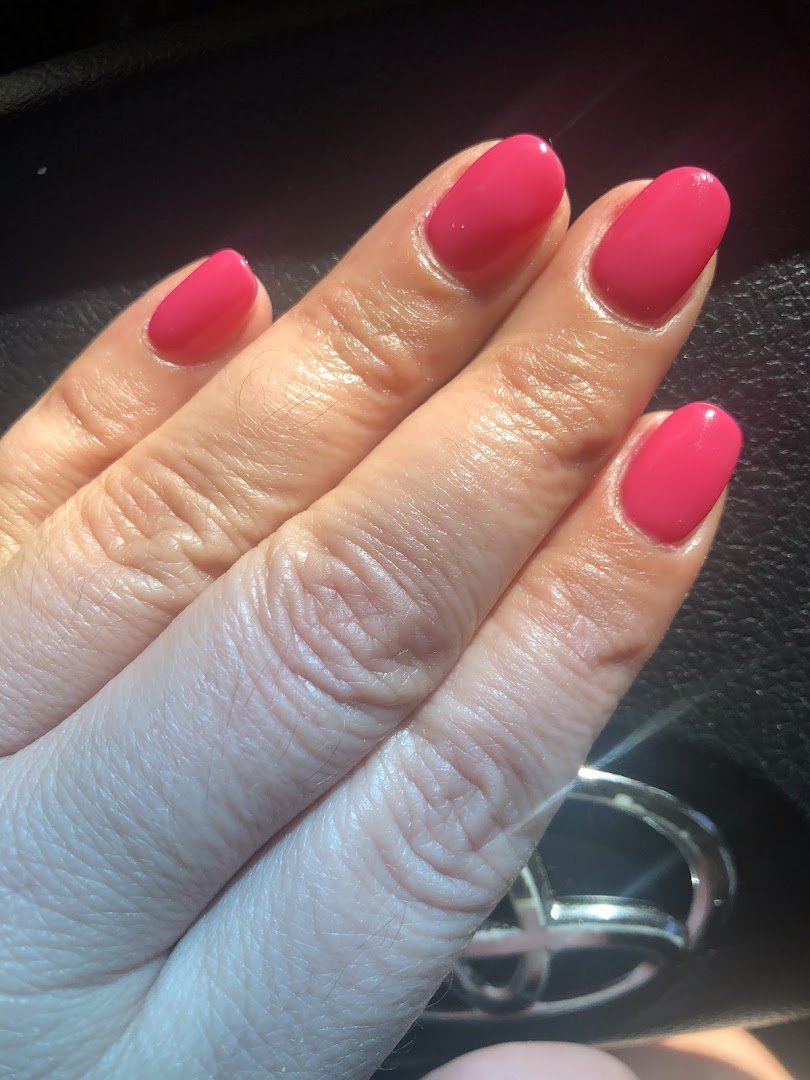 Clean salon space with tools and nail color options